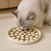 PETNEST Ceramic Bowl — Ivory paw-pattern in use by a cat