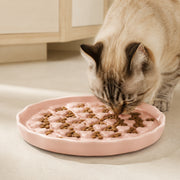 PETNEST Ceramic Bowl — Blush pink paw-pattern in use by a cat
