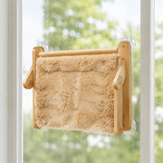 Close-up detail of the foldable wooden window perch — warm beige fleece large