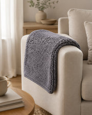 Gray Coral-Fleece Blanket — 40 × 60 cm in a warm neutral home setting