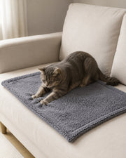 Cat using the gray coral-fleece blanket — 40 × 60 cm