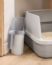 Integrated Litter Scoop / Waste Bin — 10 Rolls in a warm neutral home setting