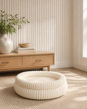 Ribbed Plush Bolster Bed — Cream Large in a warm neutral home setting
