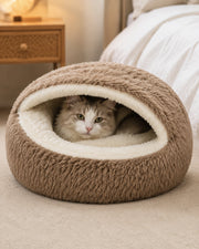 Cat using the shell-shaped plush cave bed — khaki large
